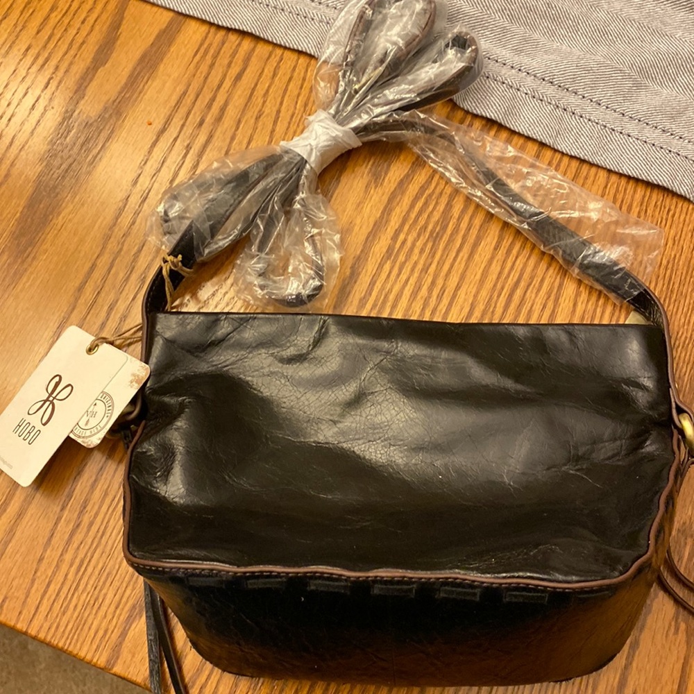 Beautiful, brand-new, black HOBO crossbody bag.